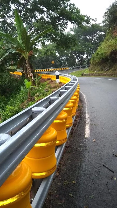 Rolling barrier on a tight bend beside vegetation